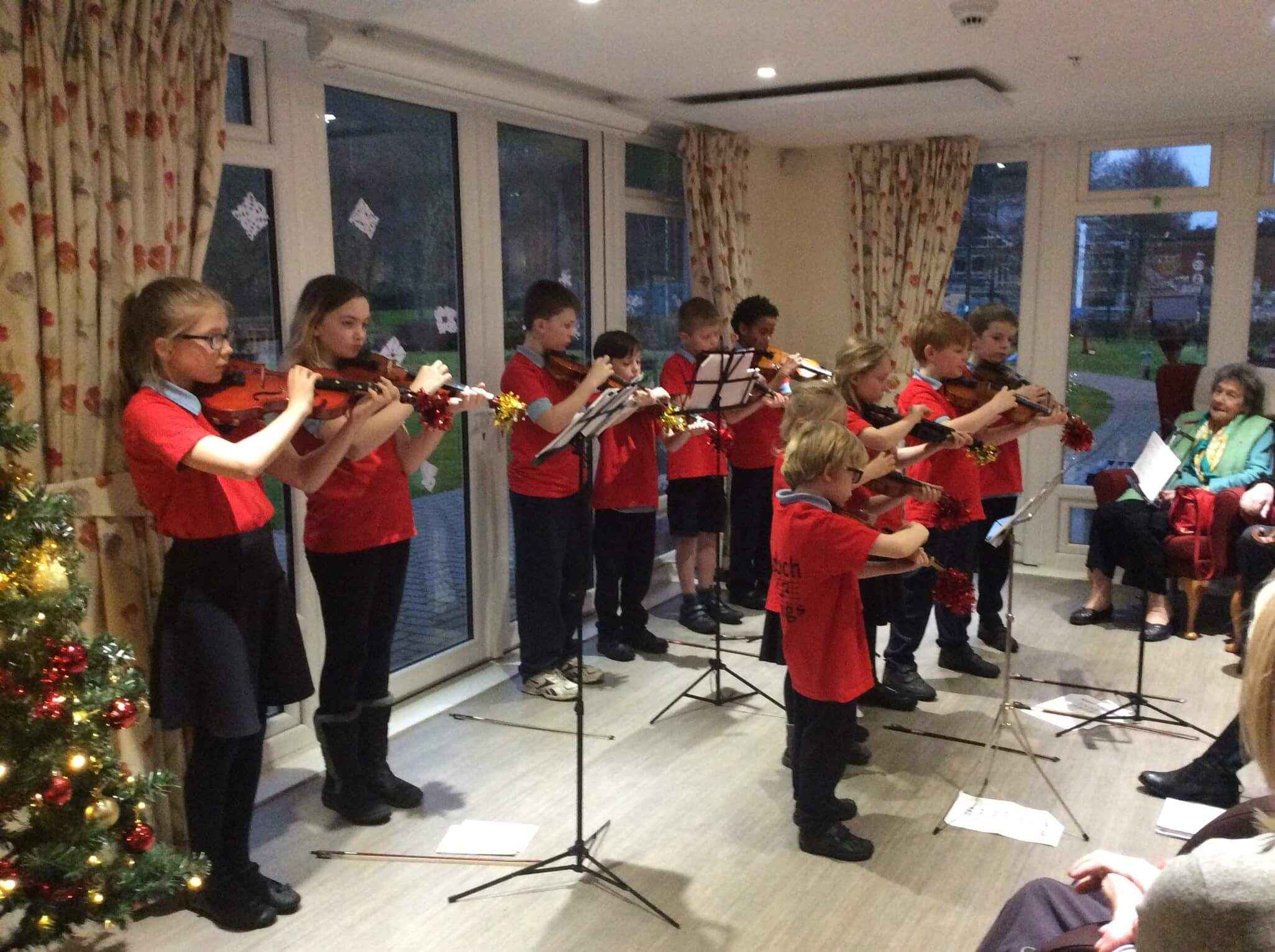 The ardoch Strings playing at a care home during Christmas